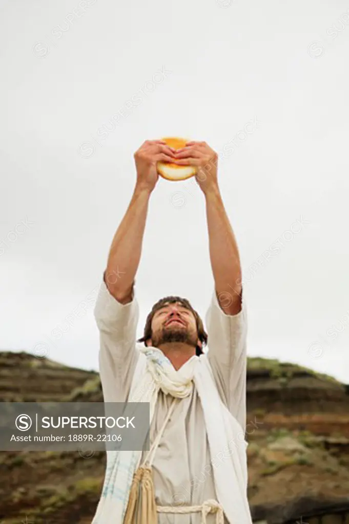 Jesus breaks bread