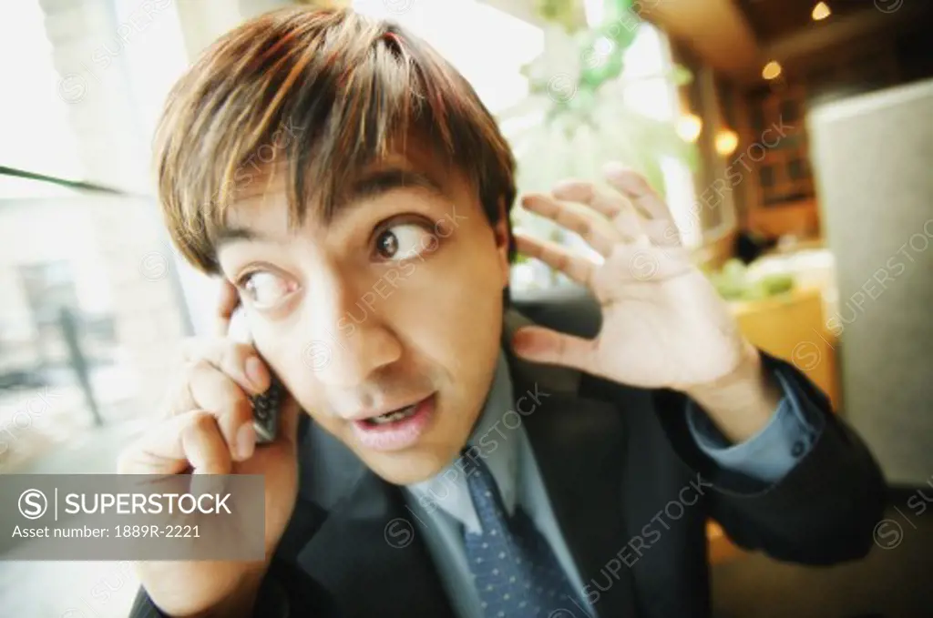 Man listening on cell phone