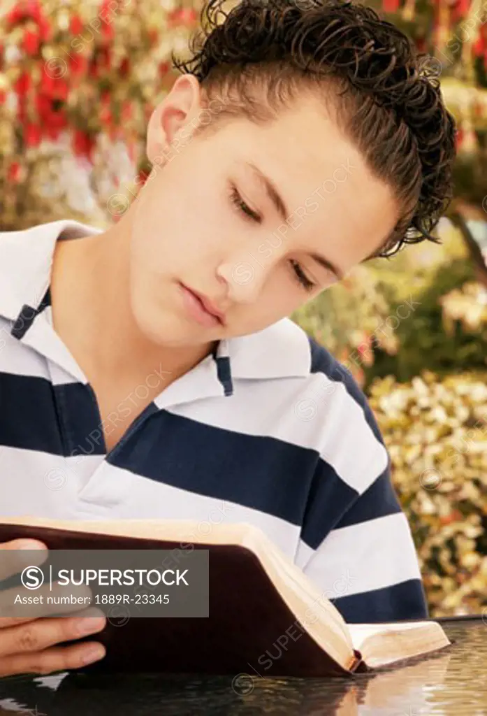 Child reads Bible