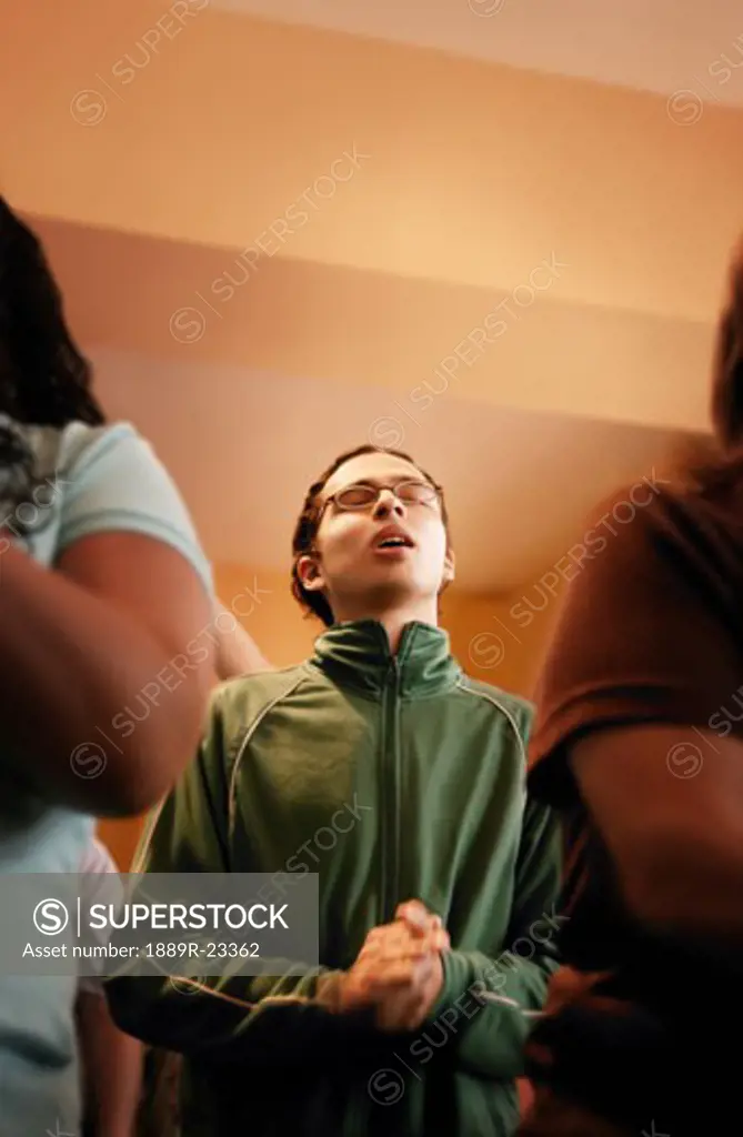 Young man in prayer service