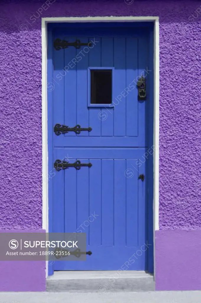 Purple wall blue door