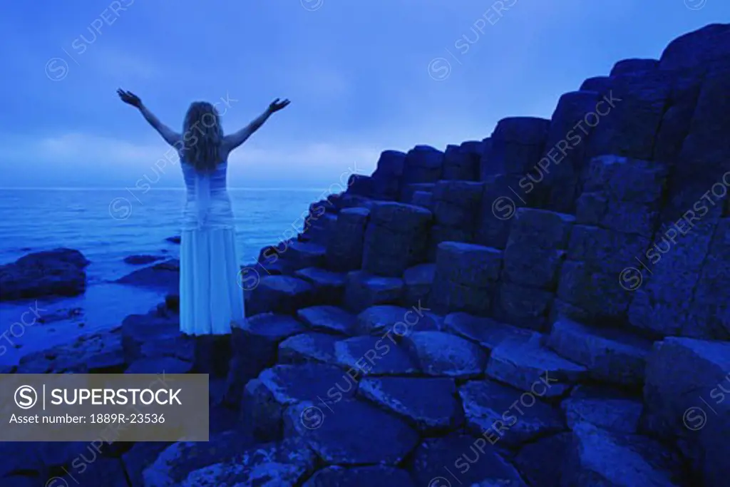 Woman Worshipping by the sea