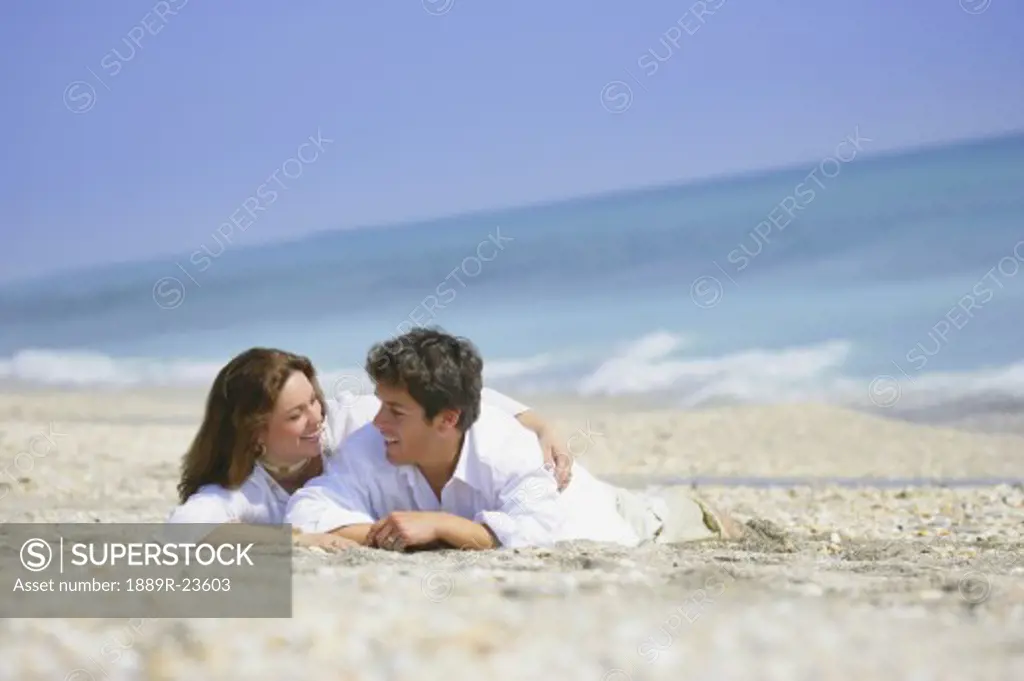 Couple Resting on Beach