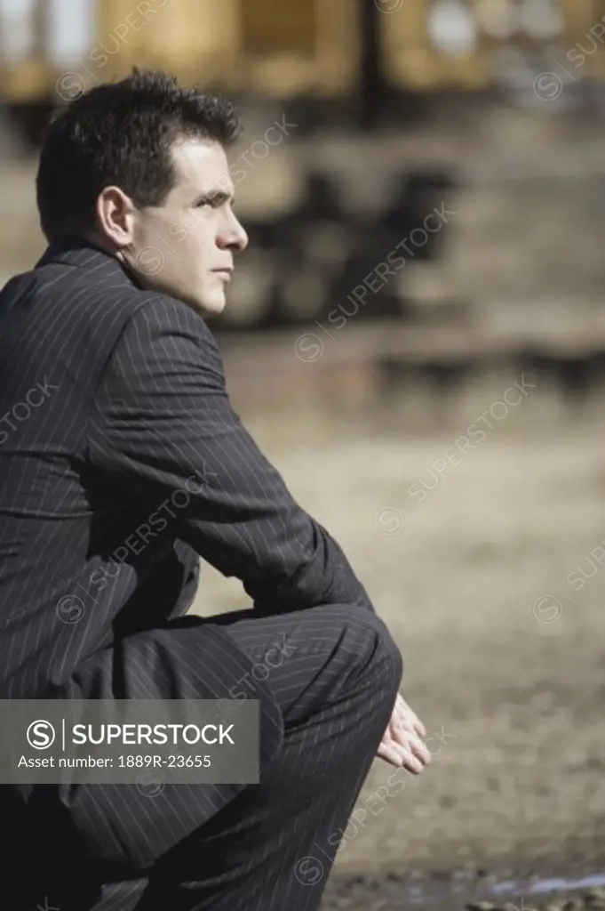 Profile of man wearing a suit