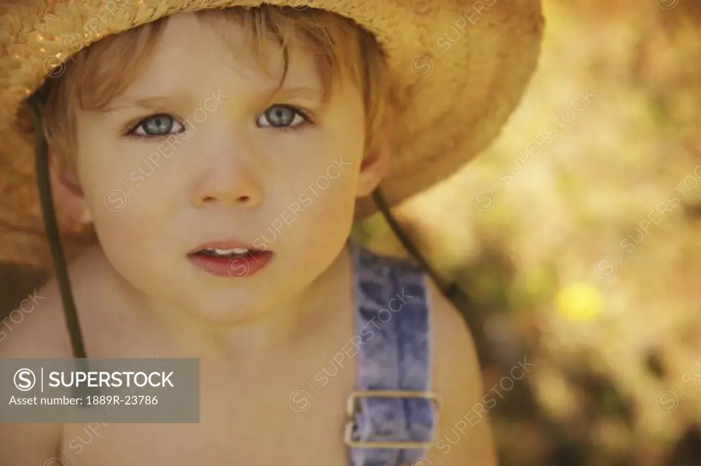 Young boy in straw hat