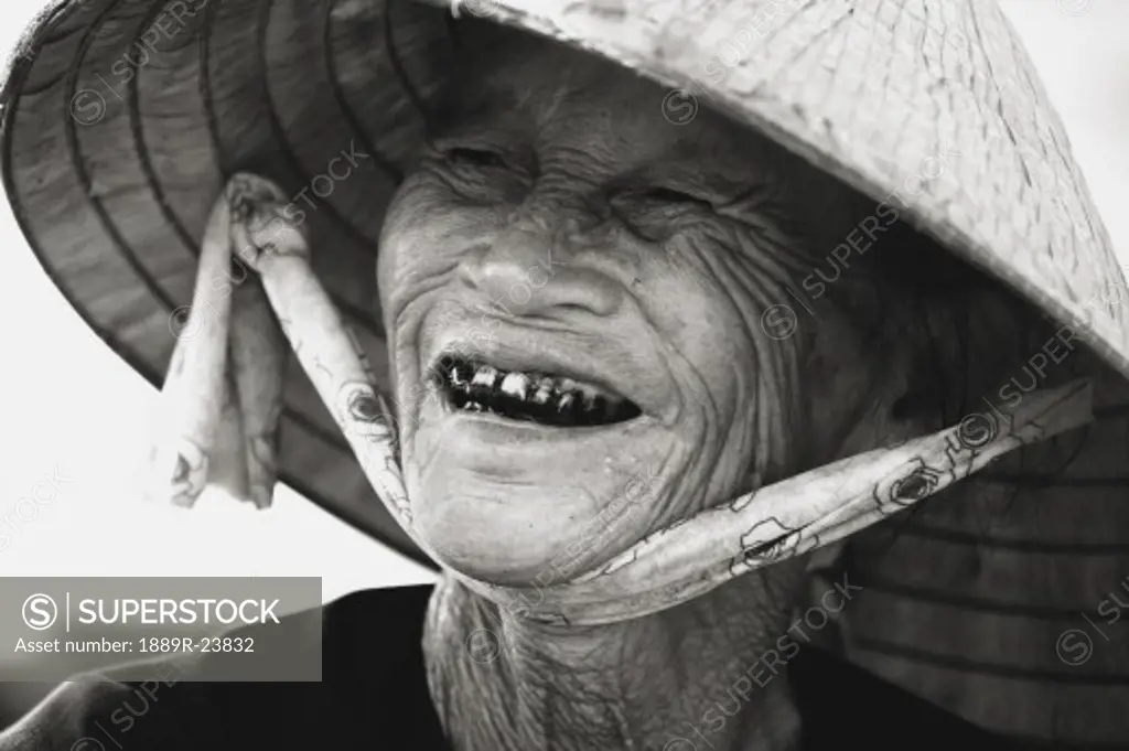 Native woman wearing Conical hat, Vietnam