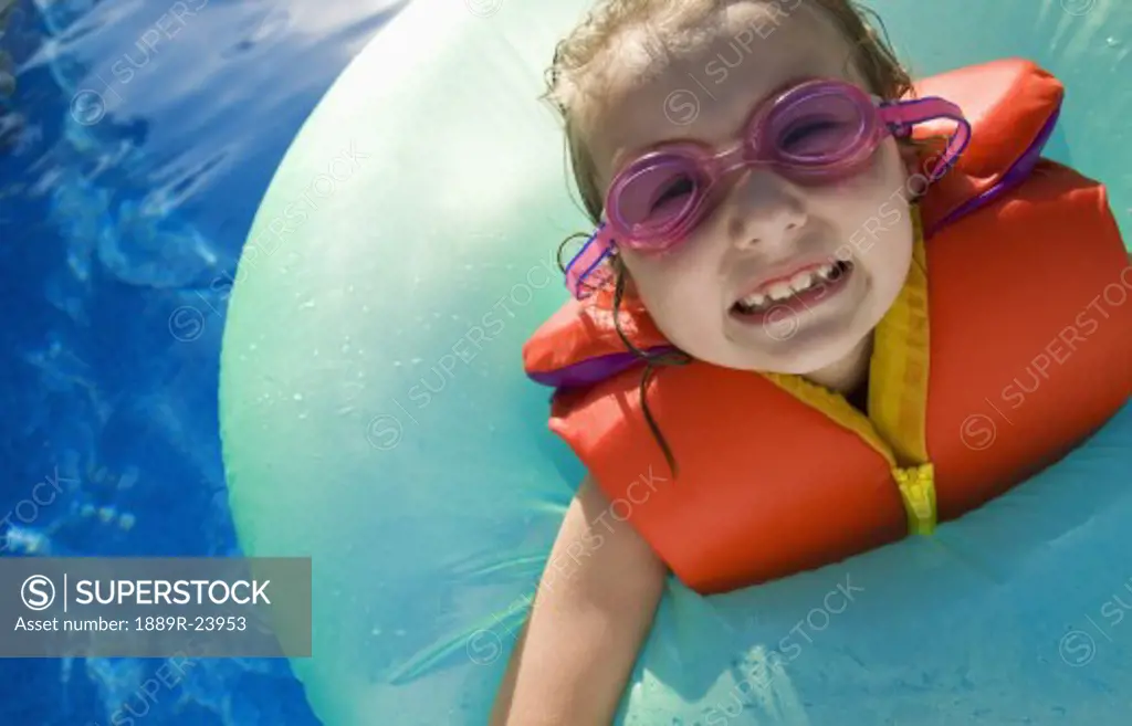 CLose up of girl with goggles and life jacket