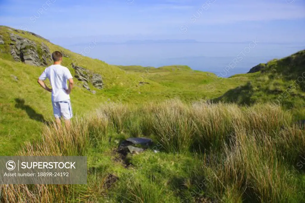 Man standing on a hillside in Ireland
