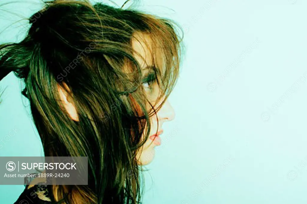Young woman with wind-blown hair