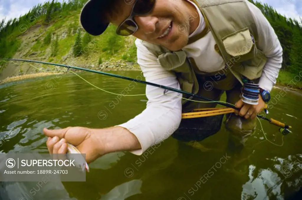 Fly fishing in an Alberta river