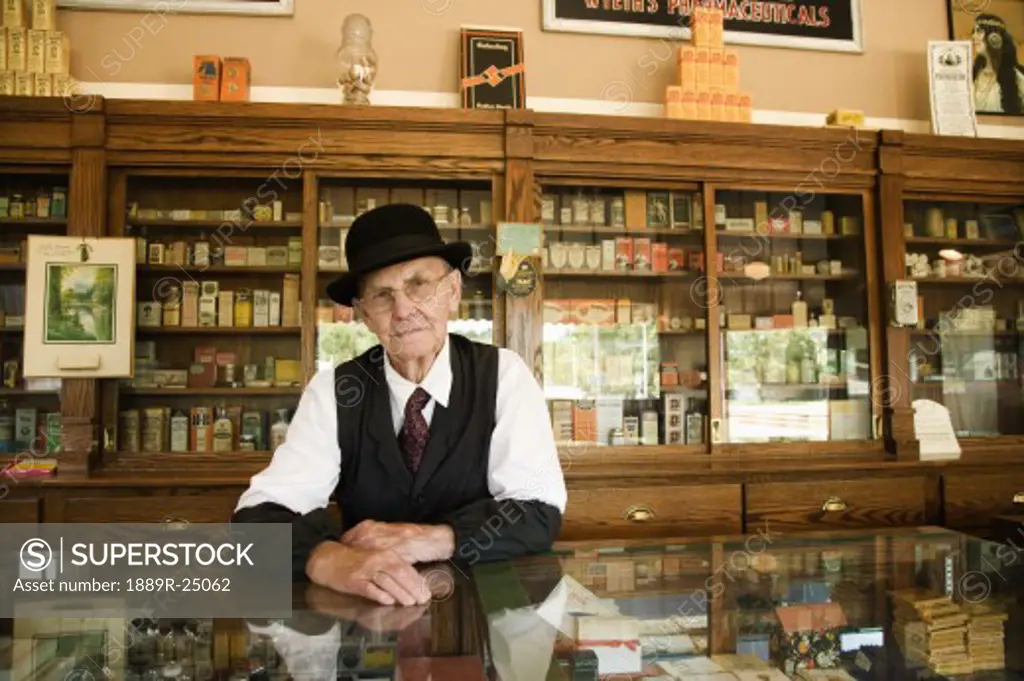Man in an old fashioned pharmacy