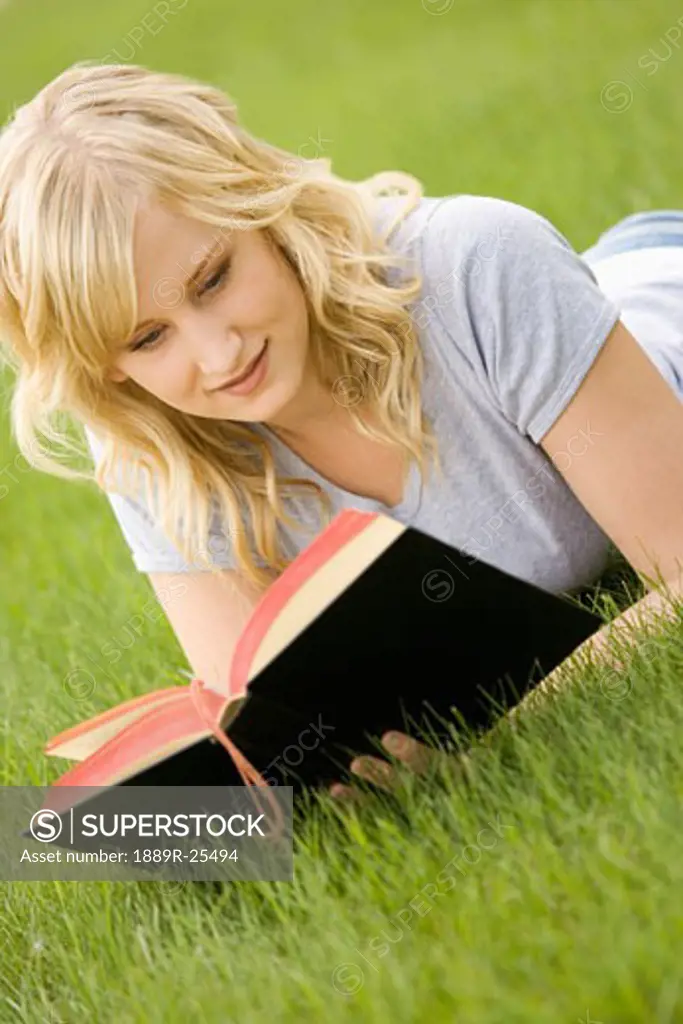 Young woman reading Bible