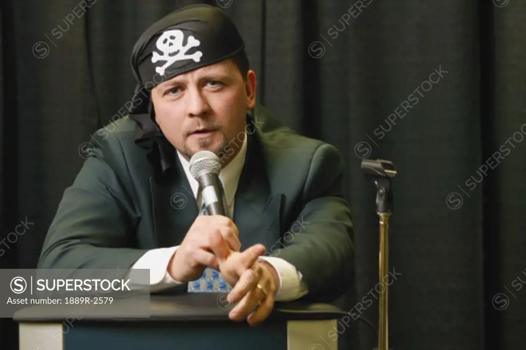 Speaker wearing pirate headgear