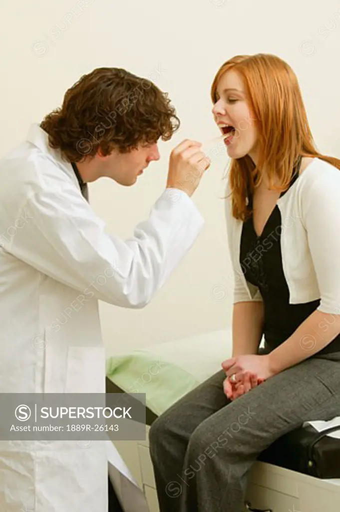 Doctor examines woman