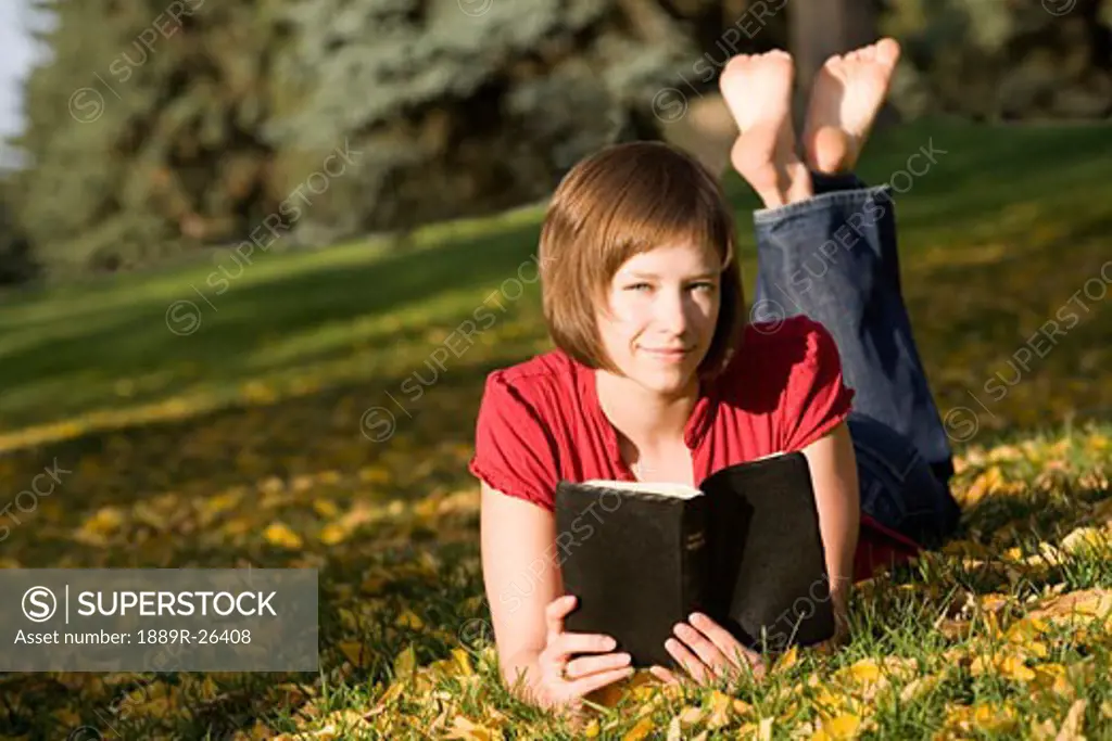 Female reading outdoors