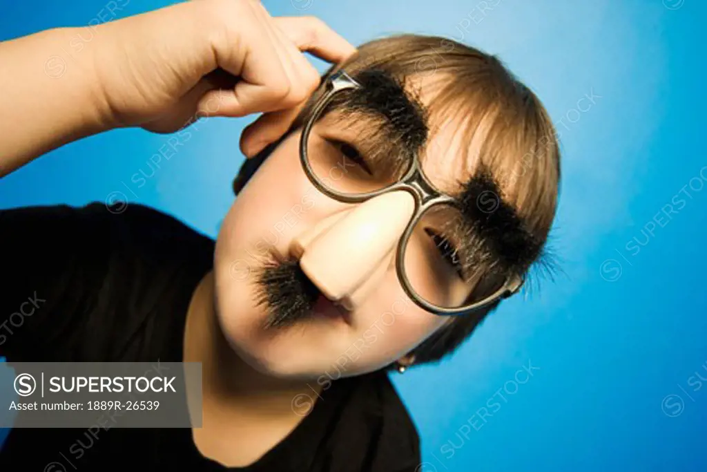 Boy in groucho glasses