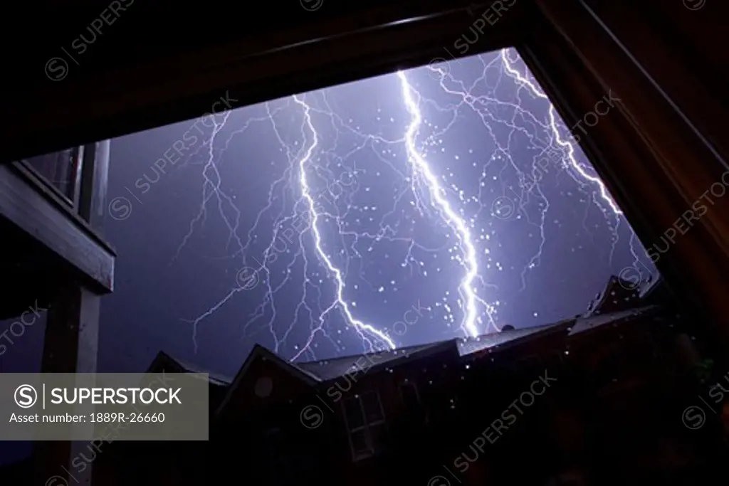 Lightening storm over homes