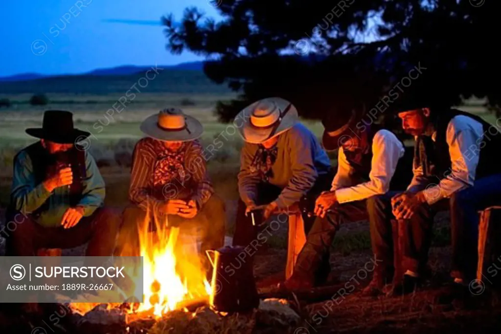 Group of cowboys around a campfire