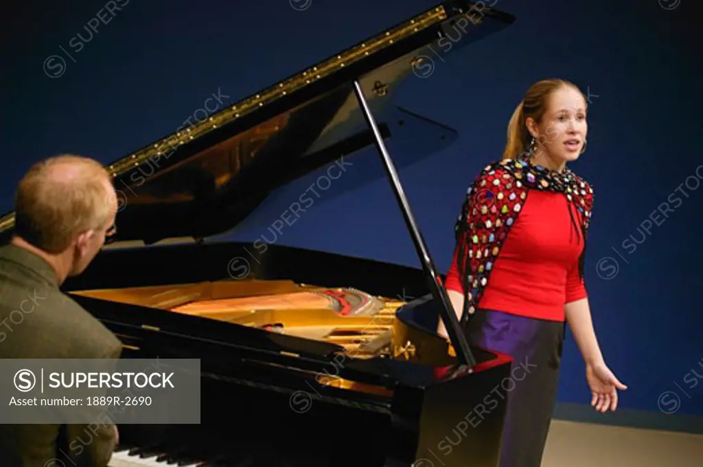 Singer being accompanied by piano