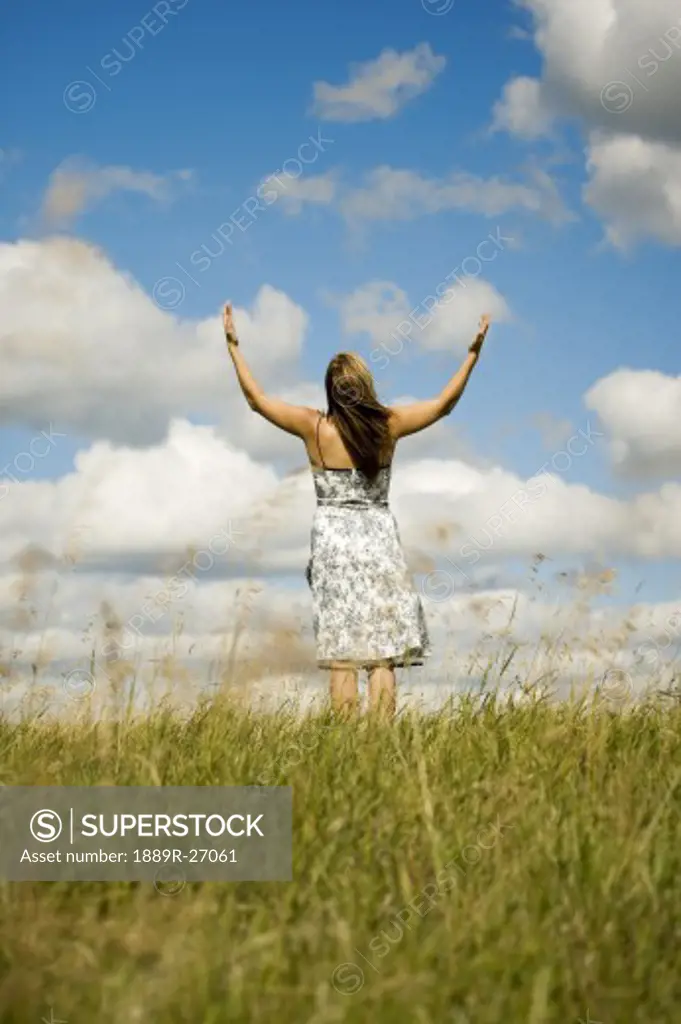 Woman with hands raised