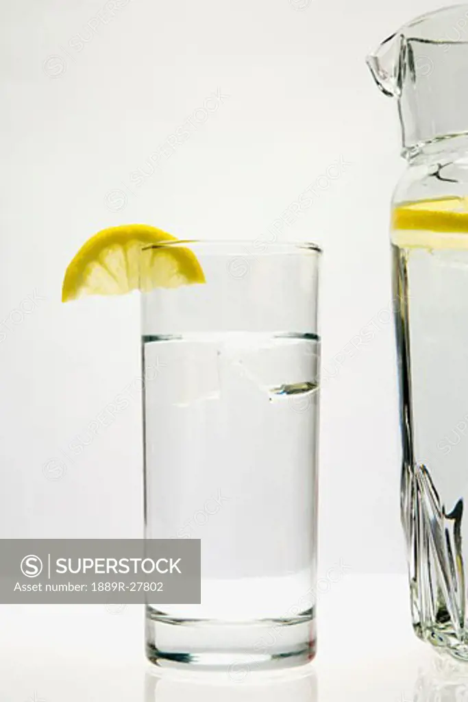 Glass and pitcher of water