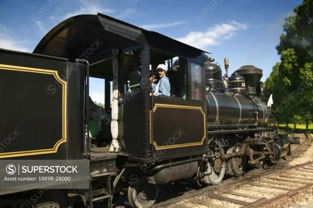 Old-fashioned train and conductor