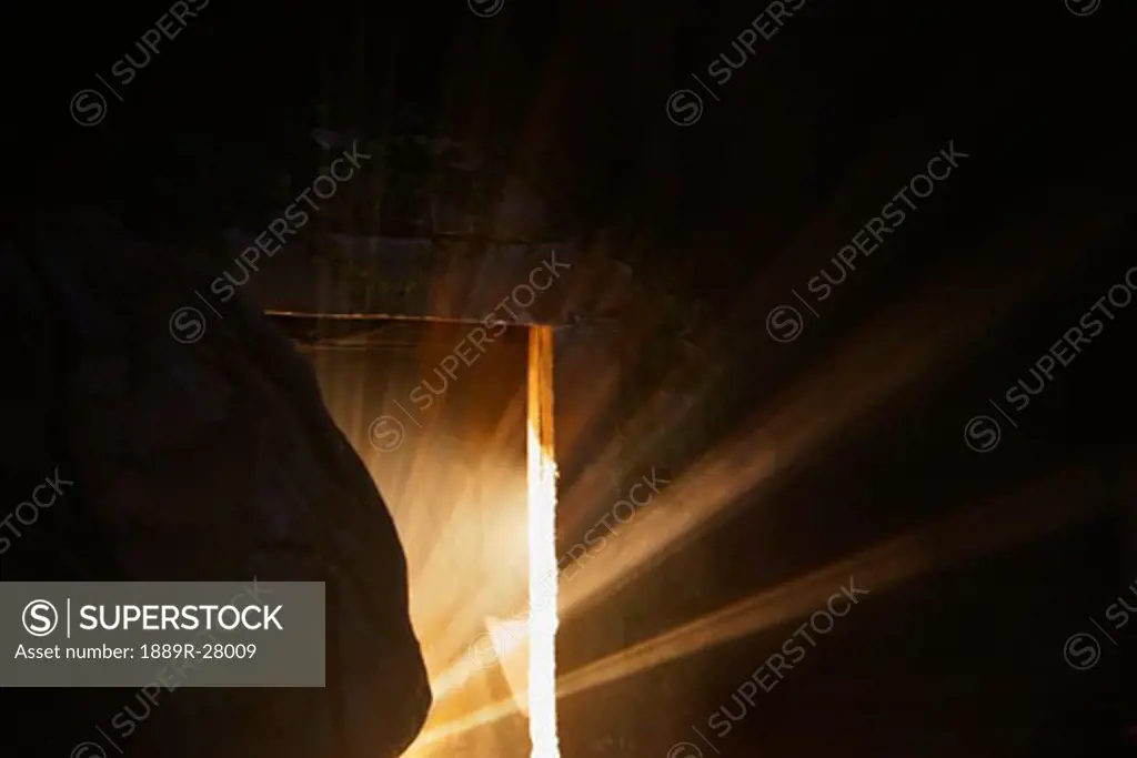 Light emerging from behind a tombstone
