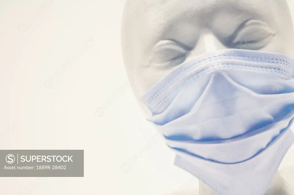 Mannequin wearing surgical mask