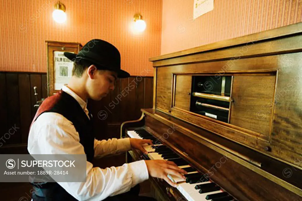 Musician playing old fashioned piano