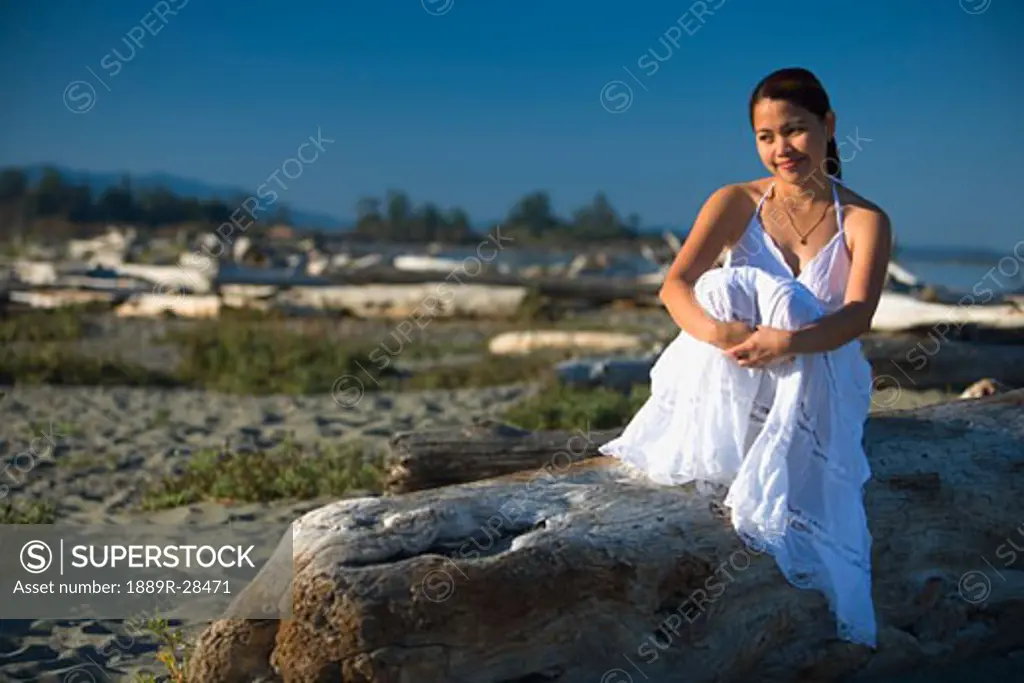 Woman sitting at the beach