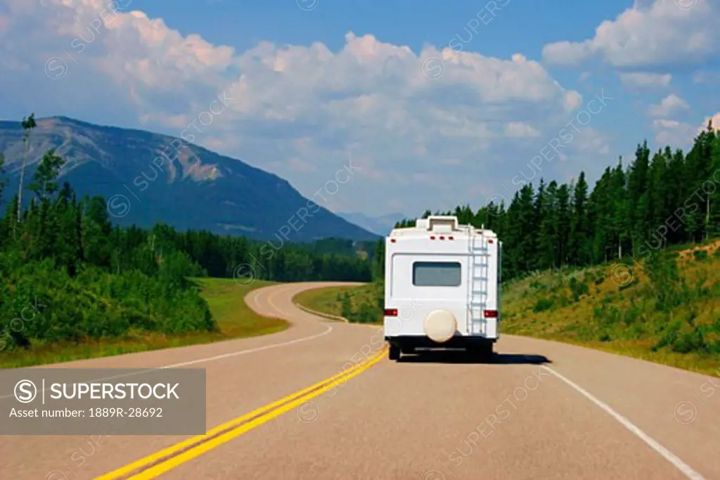 Recreational vehicle driving through the mountains