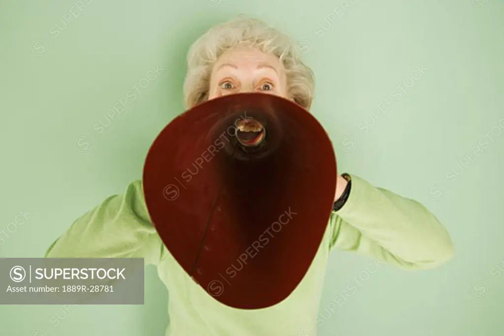 Woman shouting into a bullhorn