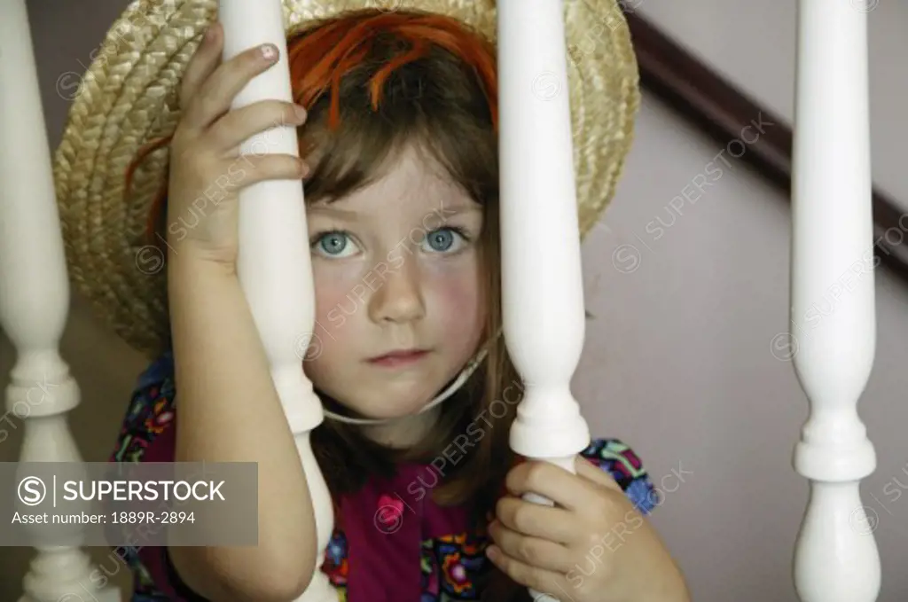 Little girl sitting on the stairs