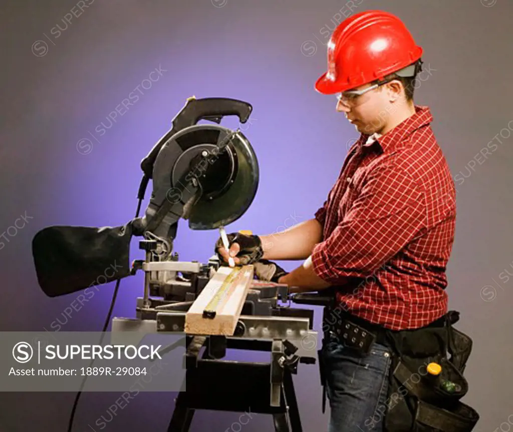 Tradesman using a table saw