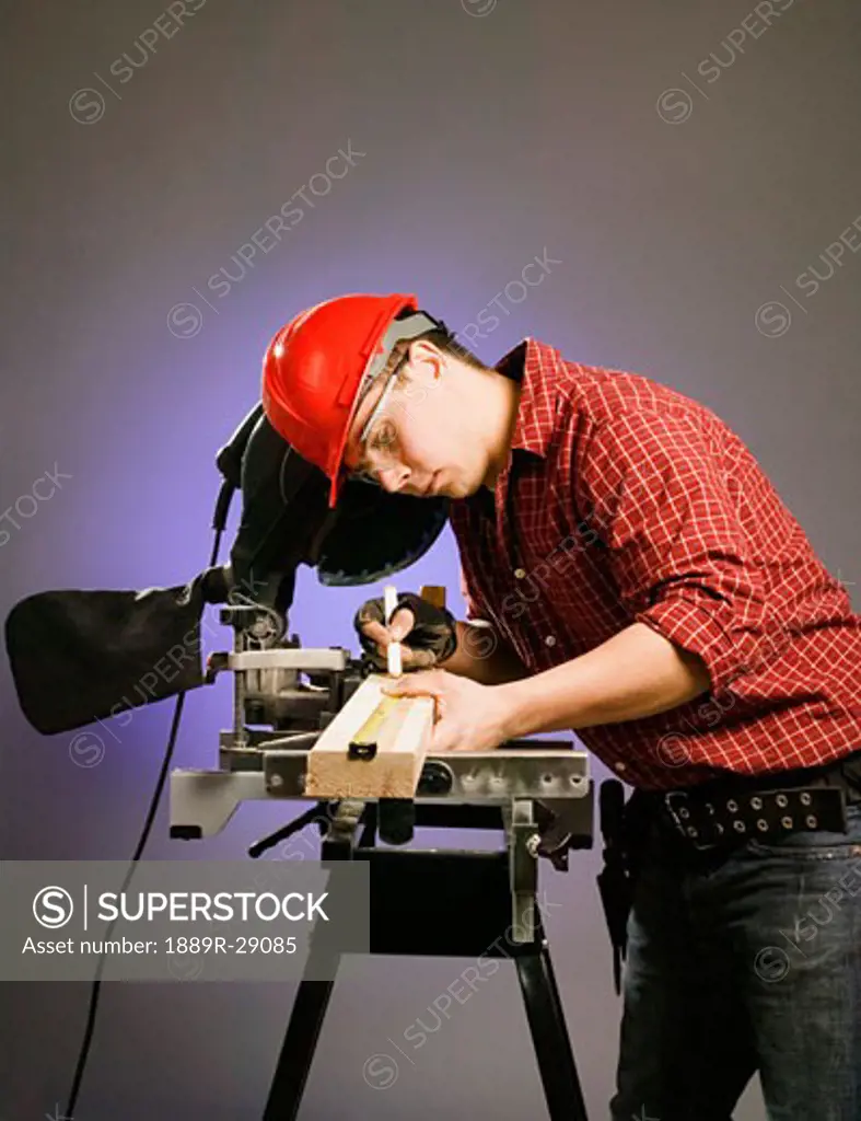 Tradesman using a table saw