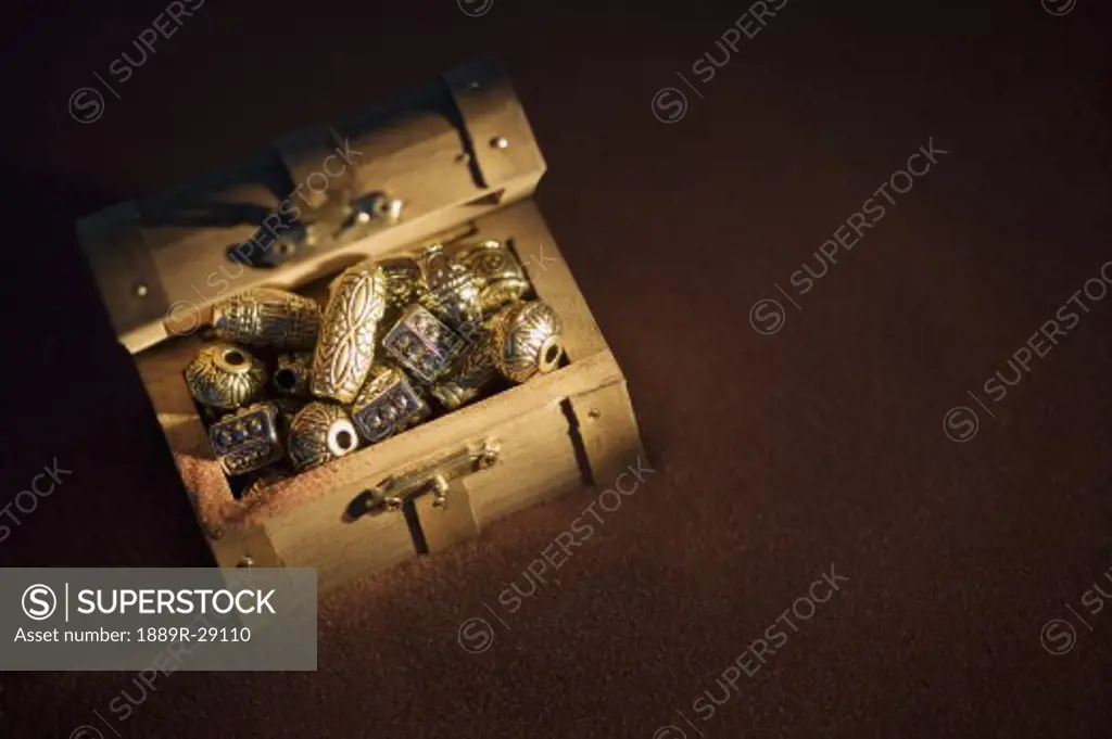 Golden beads in a box