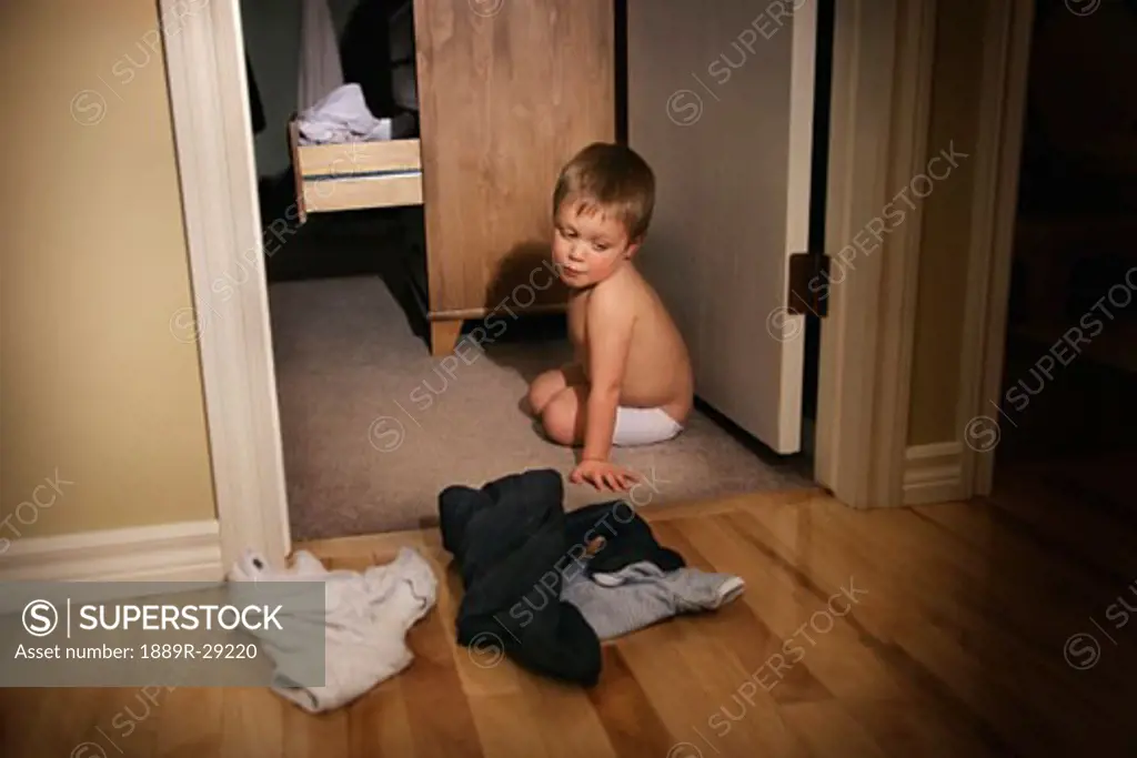 Boy refusing to get dressed