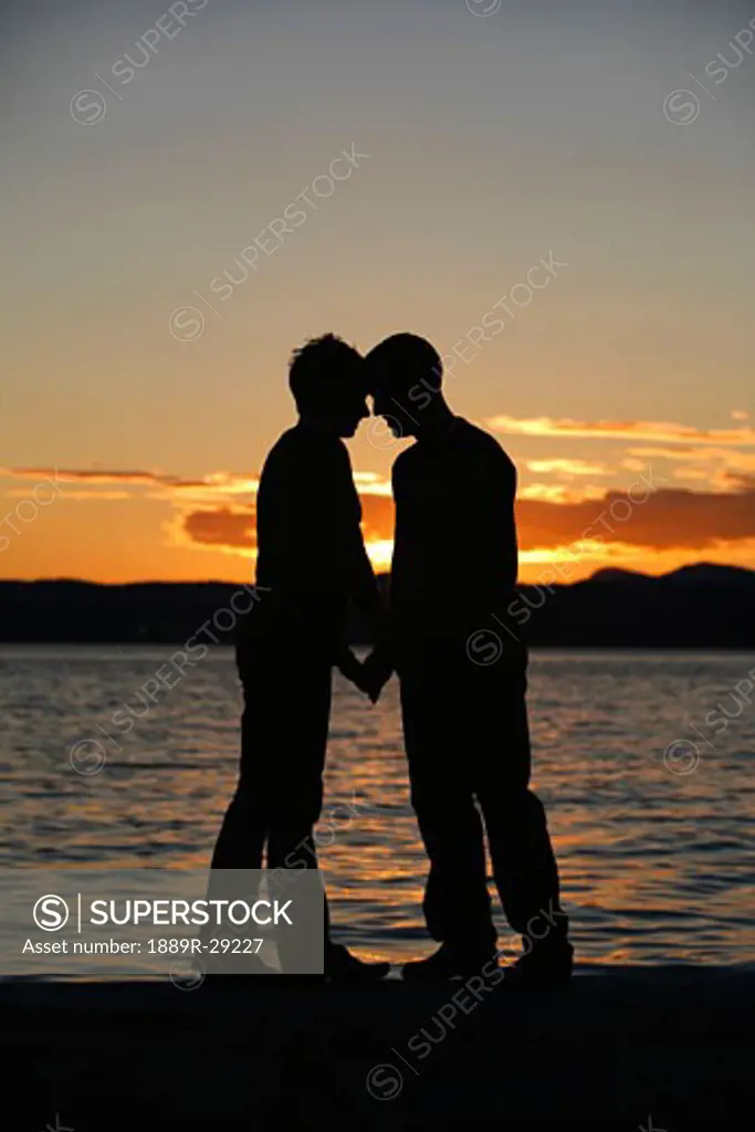 Couple standing by the water