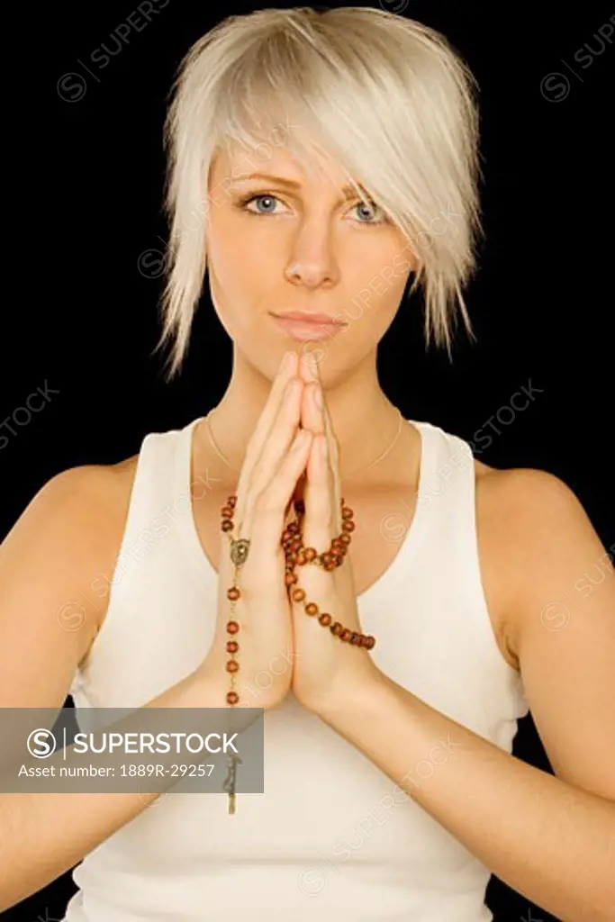 Lady holding prayer beads
