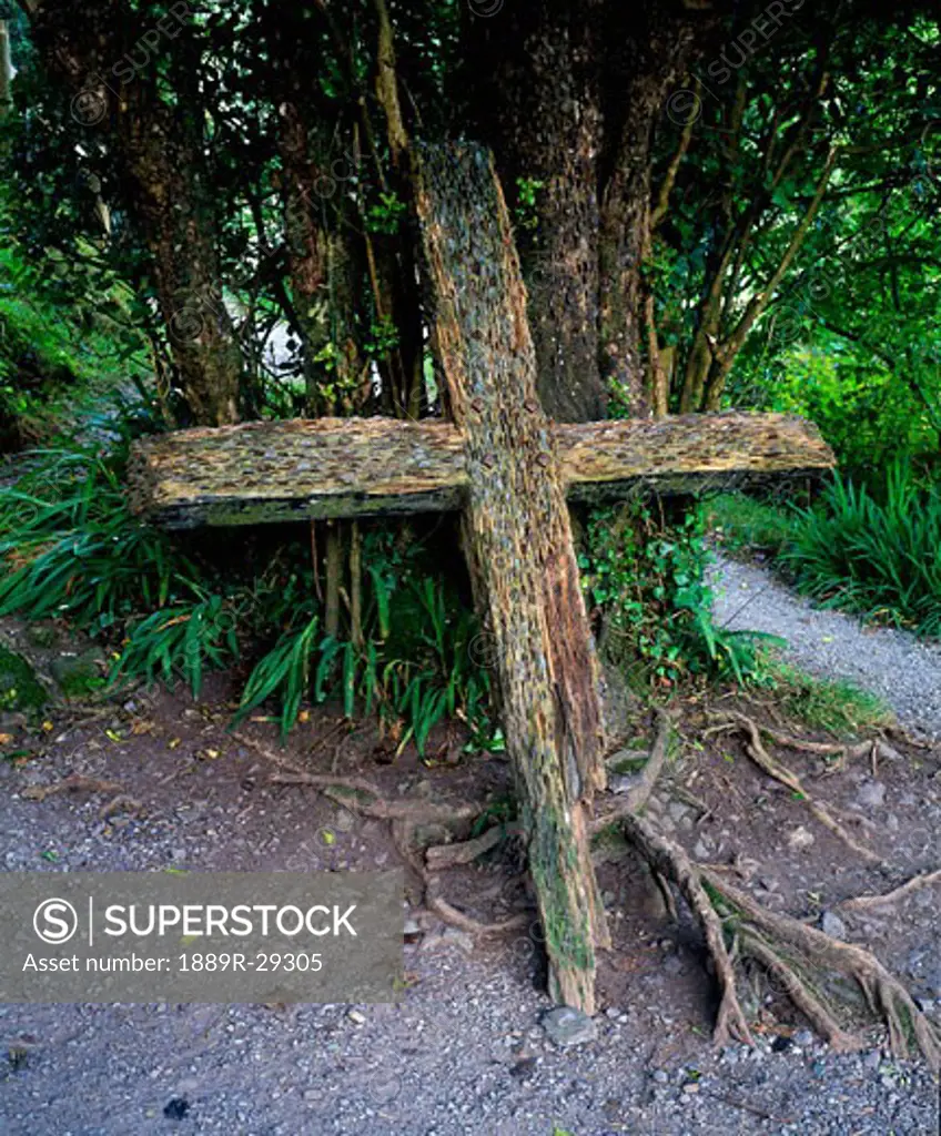 Money offering in a cross in Gougane Barra, County Cork, Ireland