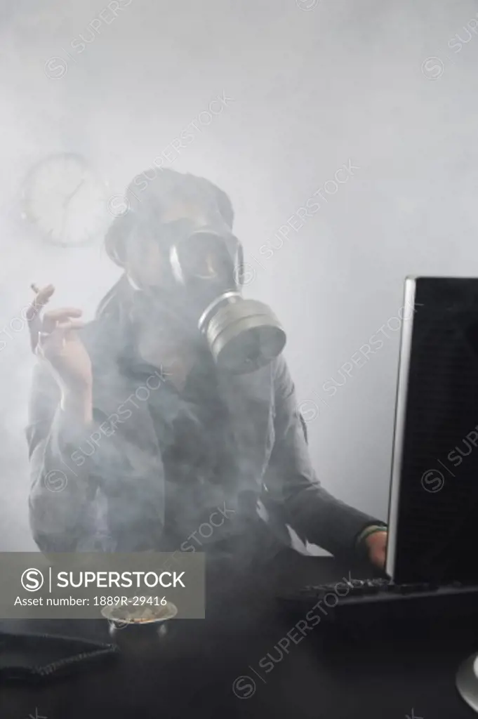 Woman smoking with gas mask