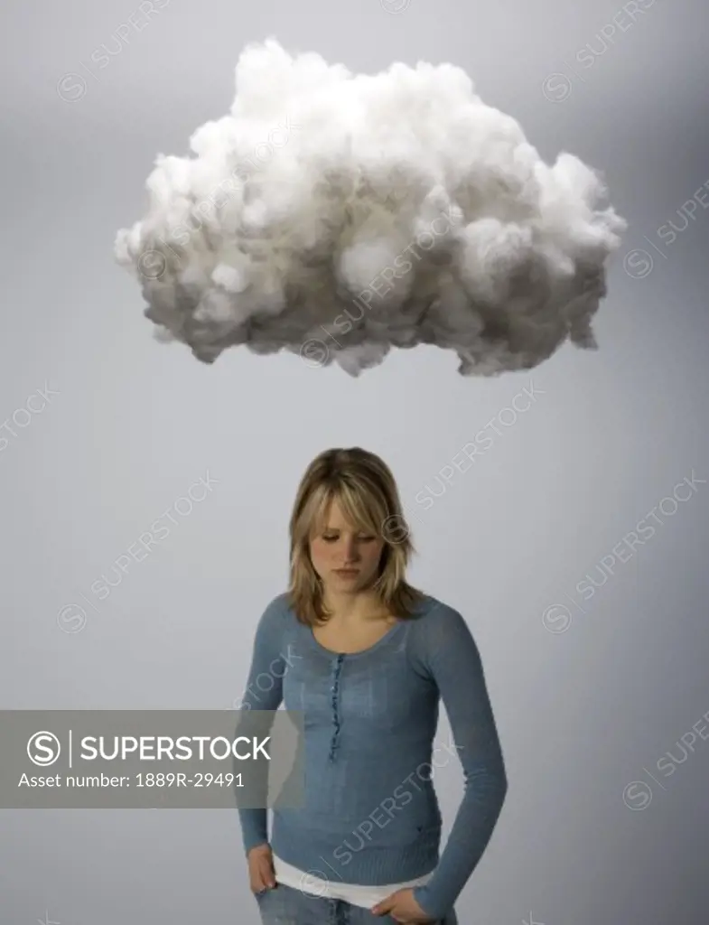 Female under hanging cloud