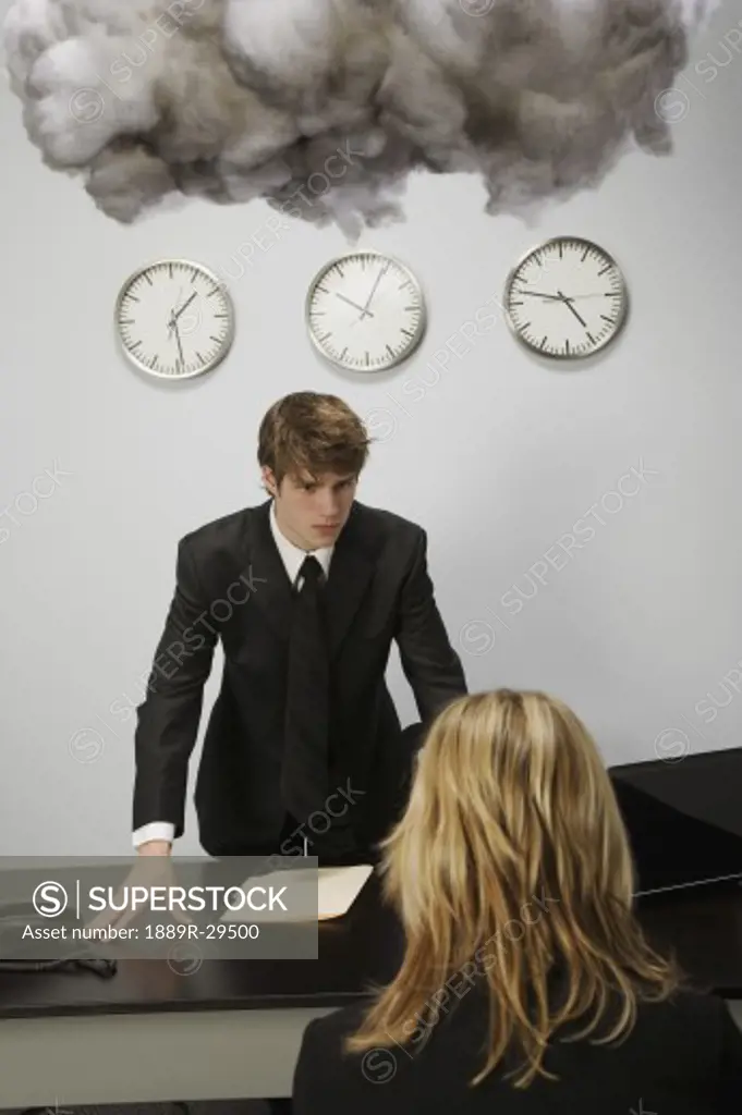 Man and woman in office under cloud