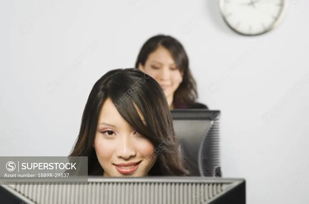 Females in front of monitors