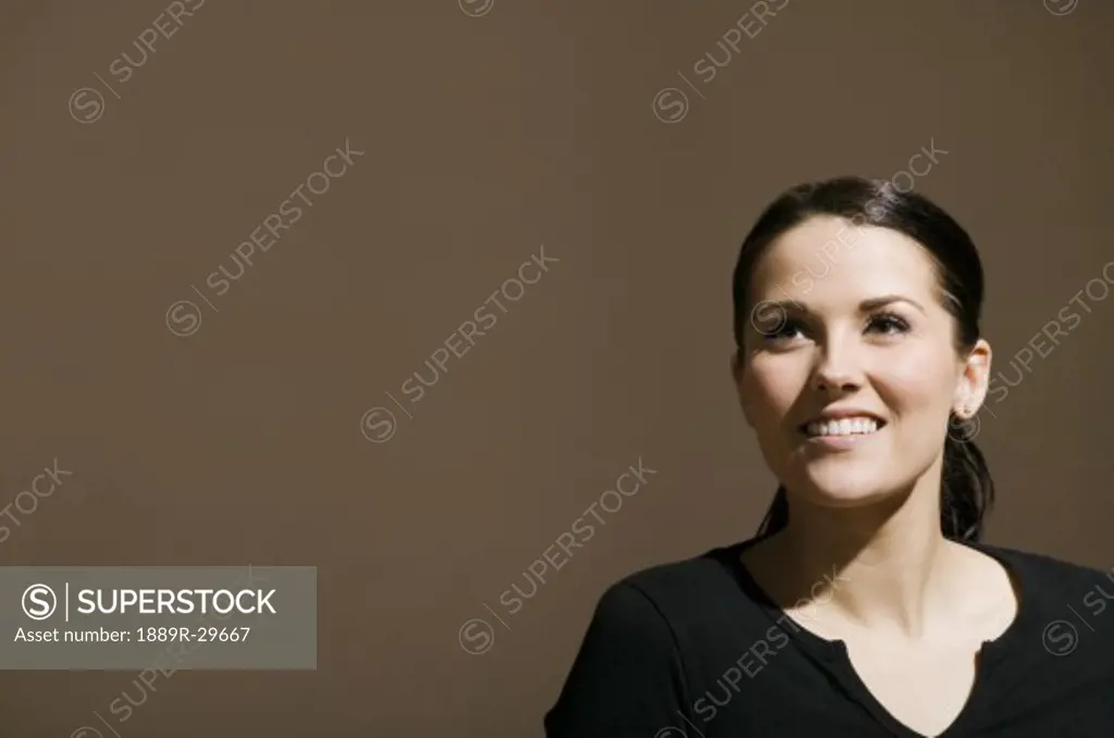 Woman looking upwards and smiling