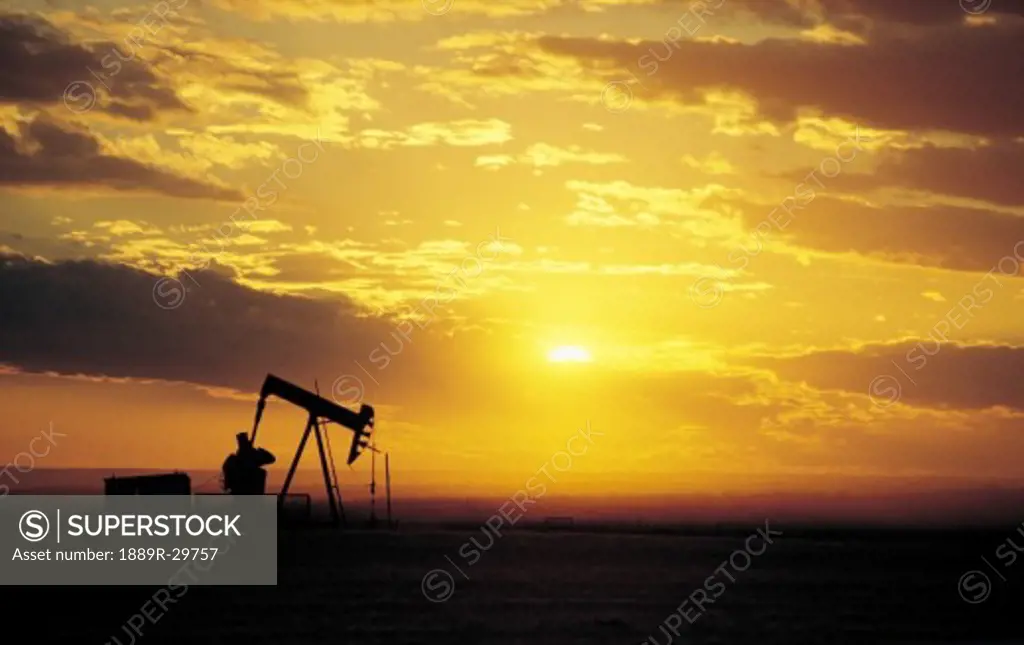 Oil well in a sunset