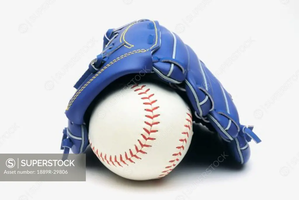A baseball and blue glove
