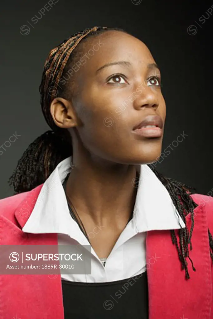 Young woman gazing upwards