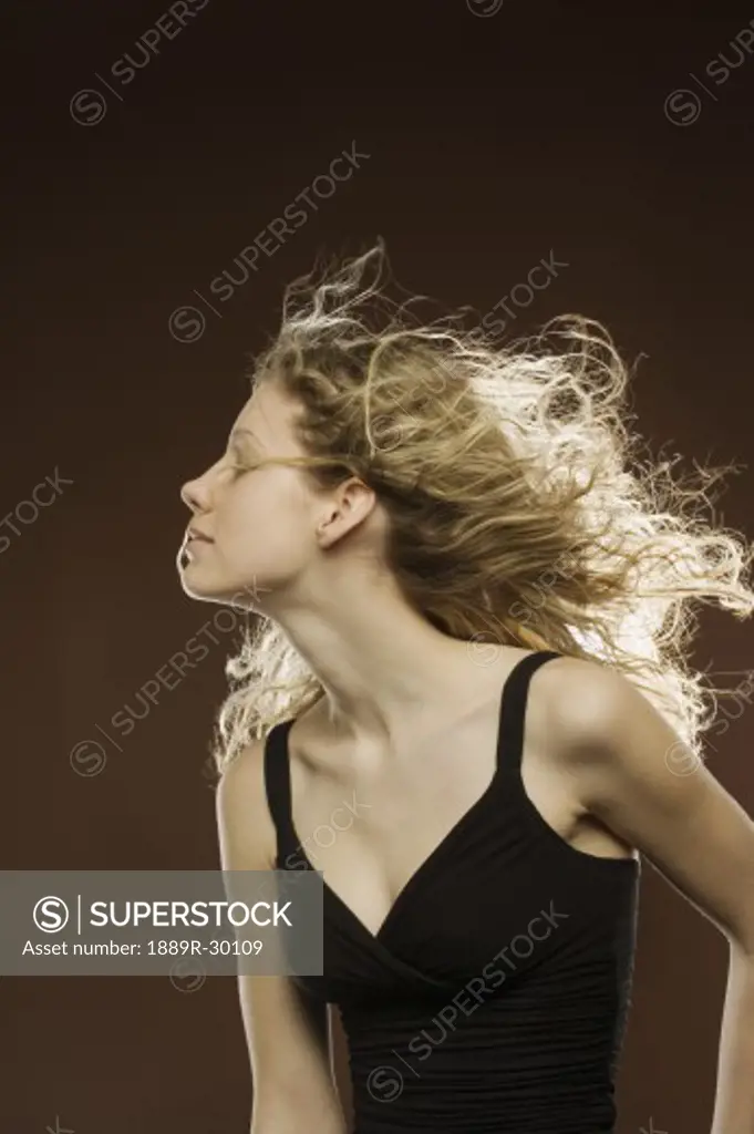 Profile of woman with wind blowing through hair