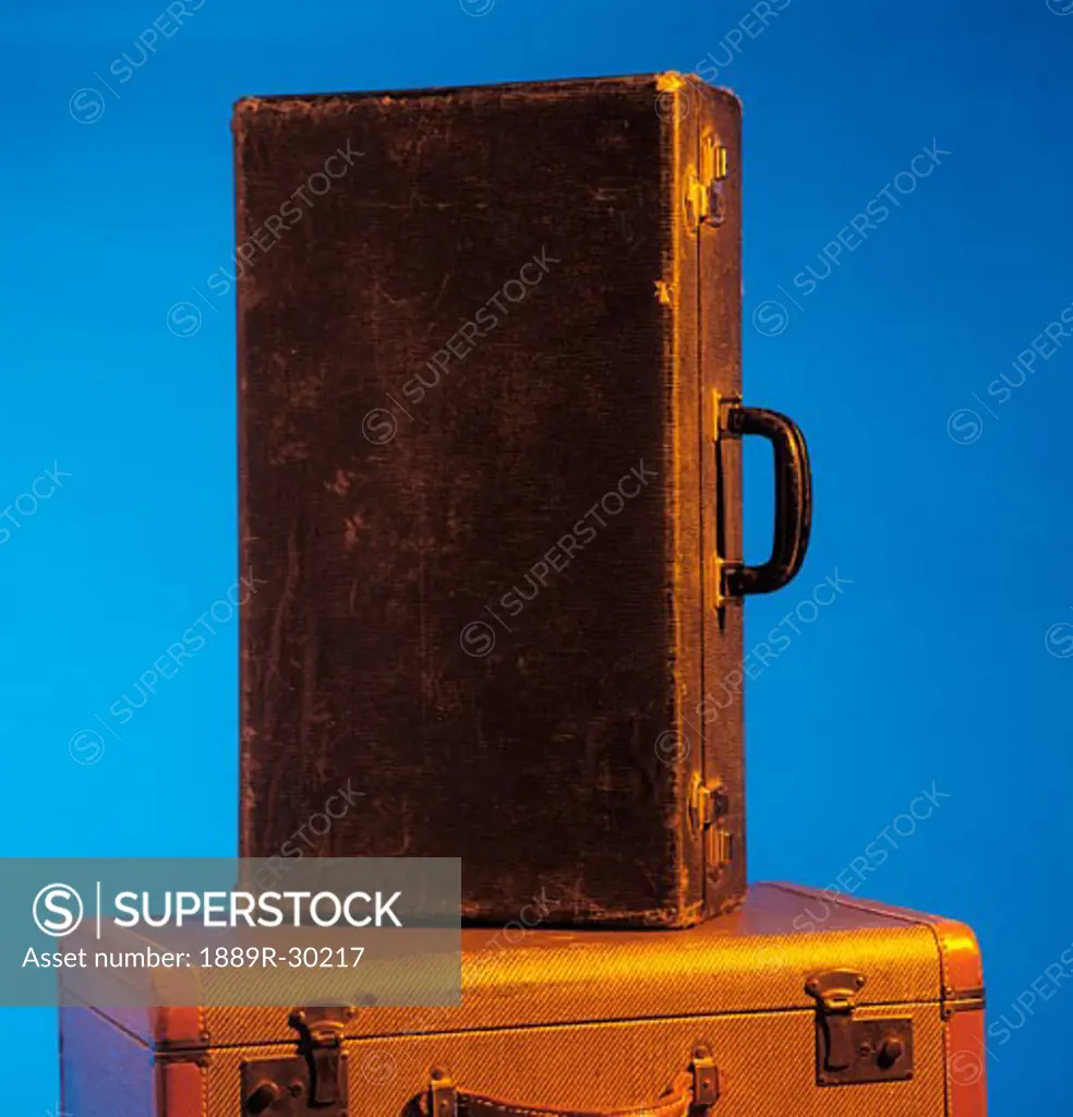 Old suitcase on top of another
